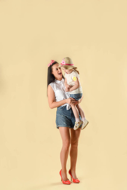Loving mother hugs and regrets her daughter. Takes care with love. Parenting. Parental love. In the studio on a light background - Fotografie, Obrázek