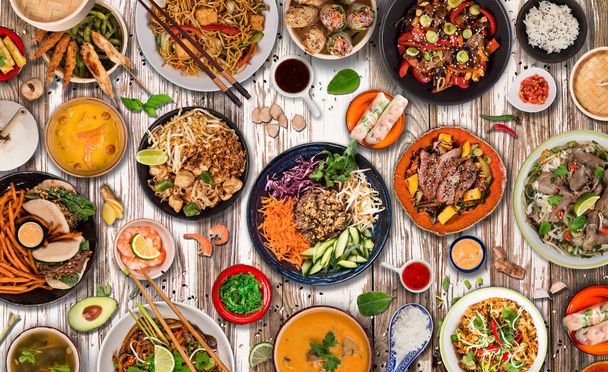 Asian food background with various ingredients on rustic wooden background , top view. - Foto, Imagen