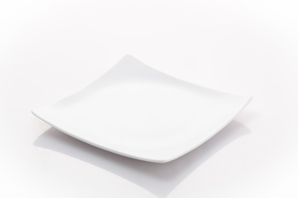 ein leerer quadratischer Teller - Foto, Bild