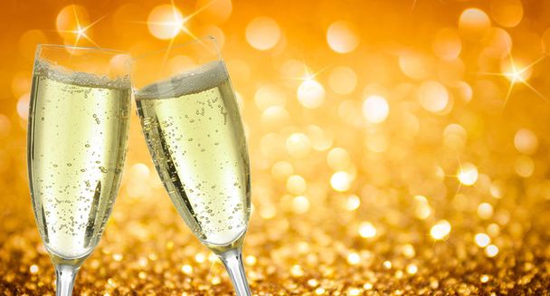 golden yellow bokeh light background texture copy space image with drink two champagne wine glasses luxury collided during the merry christmas happynewyear festival 2020 party in December winter - Photo, Image