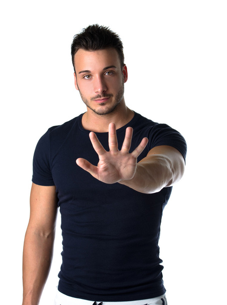 Handsome young man counting to five with fingers and hands - Photo, Image