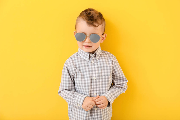 Portrait of stylish little boy on color background - Foto, Imagem