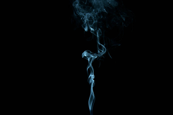 a stream of smoke on a white or black background, rises, bends and makes curls - Foto, immagini