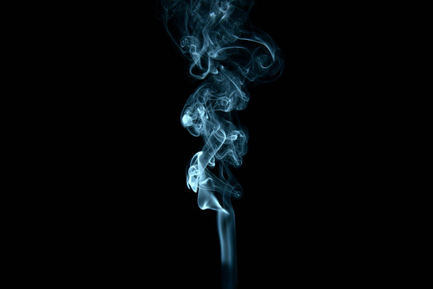 a stream of smoke on a white or black background, rises, bends and makes curls - Foto, imagen