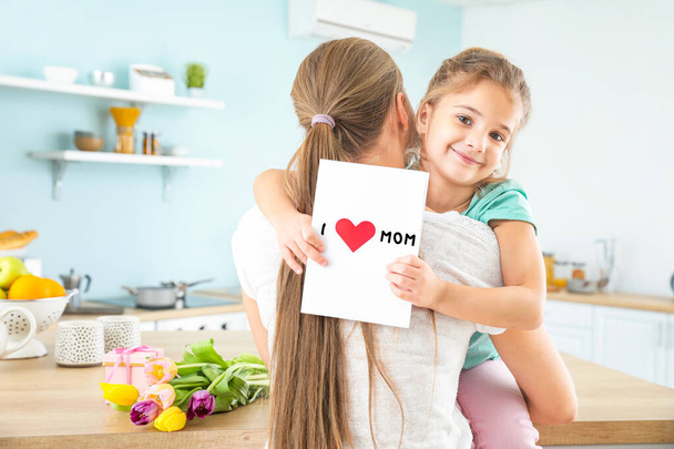Little girl greeting her mother at home - Foto, Bild