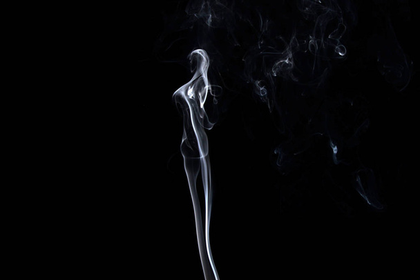 a stream of smoke on a white or black background, rises, bends and makes curls - Foto, Imagem
