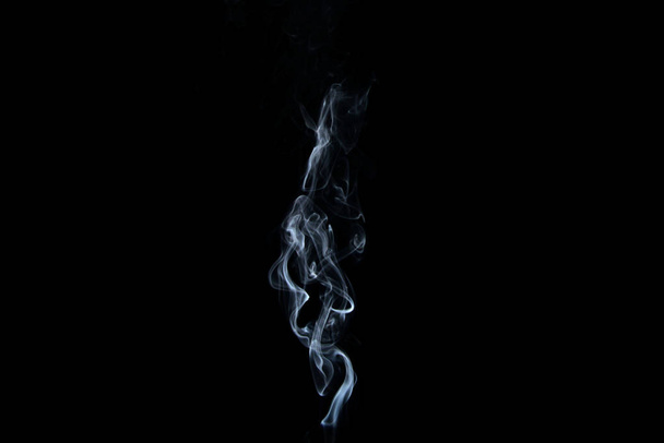 a stream of smoke on a white or black background, rises, bends and makes curls - Photo, Image