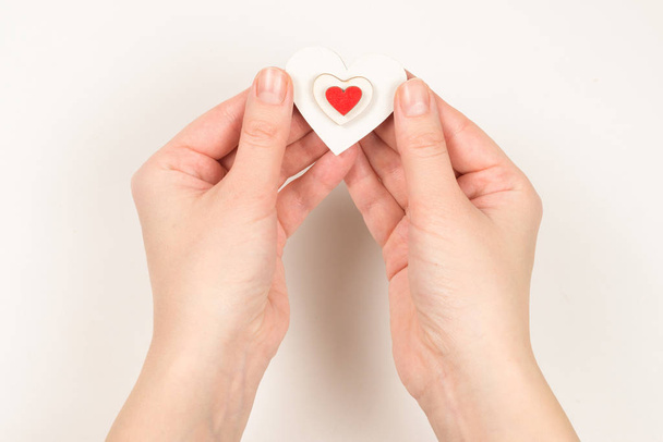 Red heart in woman hand isolated. - Photo, Image