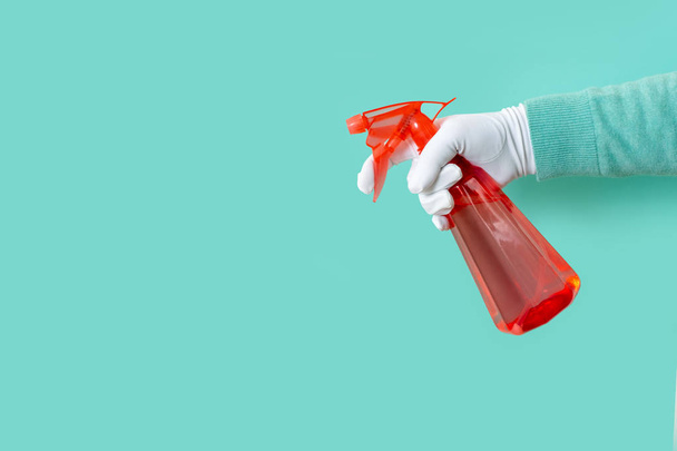 guante mano verde fondo spray dispensador un espacio de copia limpia roja
 - Foto, Imagen