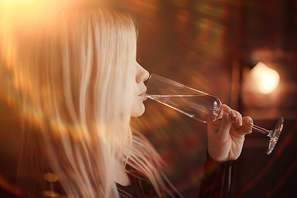 sexy blonde girl drinks champagne from a glass, evening glamorous style portrait - Zdjęcie, obraz