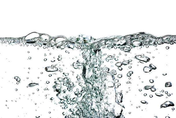A splash of water,drops and bubbles on a white background. - 写真・画像