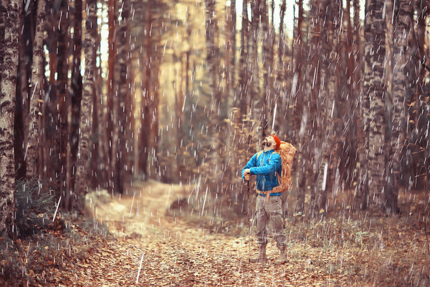 rainy autumn forest, landscape, a man on a hike in the October wet forest, bad cold weather - Fotó, kép