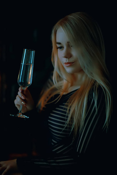 sexy blonde girl drinks champagne from a glass, evening glamorous style portrait - Photo, Image