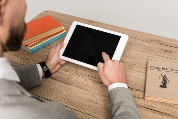 partial view of businessman holding digital tablet with blank screen isolated on grey - Photo, Image