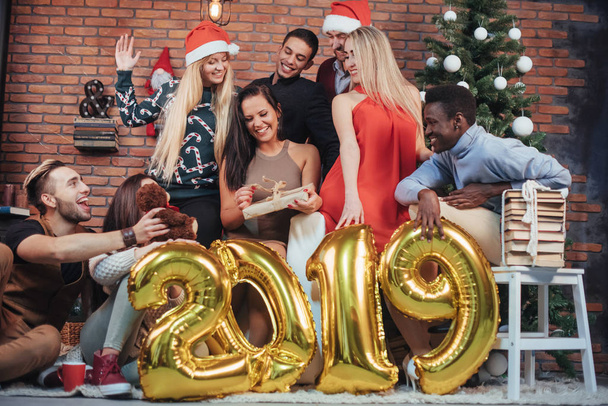 Group of Cheerful old friends communicate with each other. New 2019 Year is coming. Celebrate the new year in a cozy home atmosphere. - Valokuva, kuva