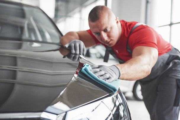 Professional cleaning and car wash in the car showroom. - Photo, Image