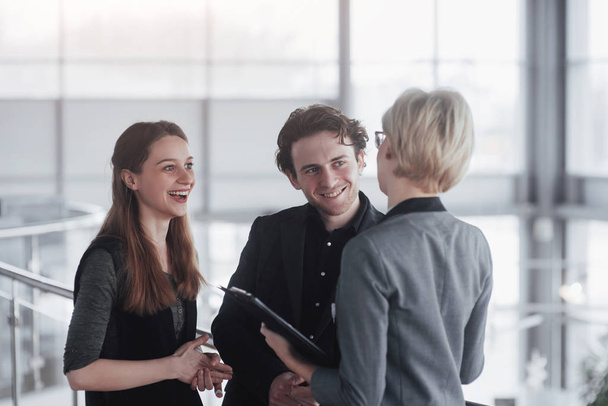 business, technology and office concept - smiling female boss talking to business team. - Photo, Image