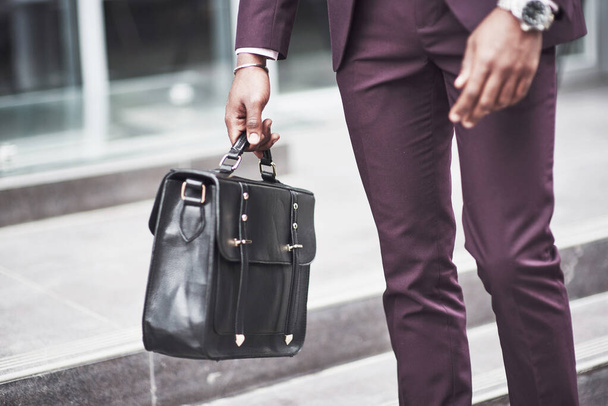 Young businessman with a briefcase near a beautiful office. Business meeting - Foto, Bild