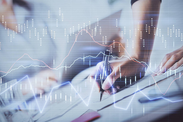 A woman hands writing information about stock market in notepad. Forex chart holograms in front. Concept of research. Double exposure - Foto, Imagem