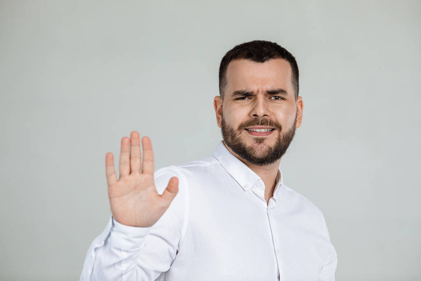 handsome bearded man showing stop gesture - Photo, Image