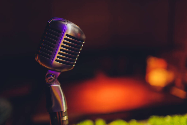 Lets sing Stylish retro microphone on a colored background. - 写真・画像