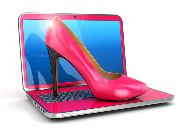 Women's laptop. High heel shoes on keyboard. - Photo, image