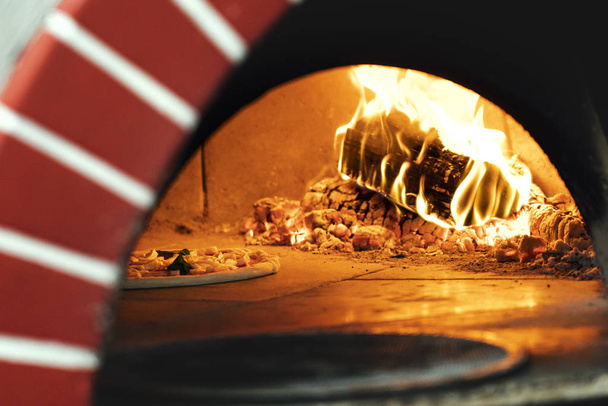 Pizza baking in the oven - Foto, immagini