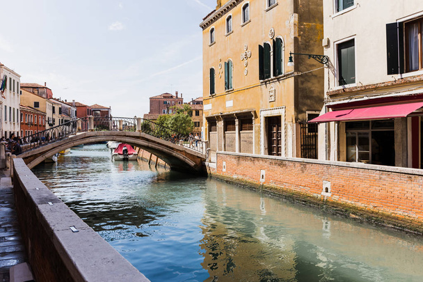 VENICE, ITALY - SEPTEMBER 24, 2019: bridge above canal and ancient buildings in Venice, Italy  - Fotoğraf, Görsel