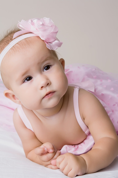 Baby girl in pink dress. - Фото, изображение