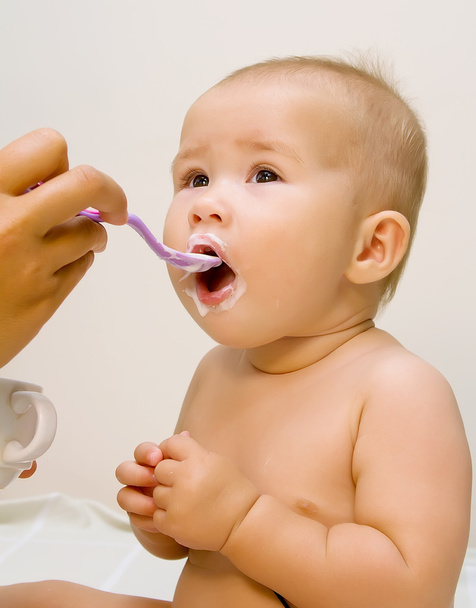 The small child, eats from a spoon - Photo, image