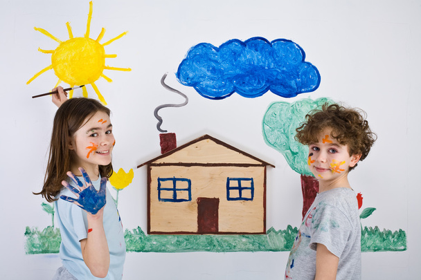 Children painting on wall - Fotó, kép