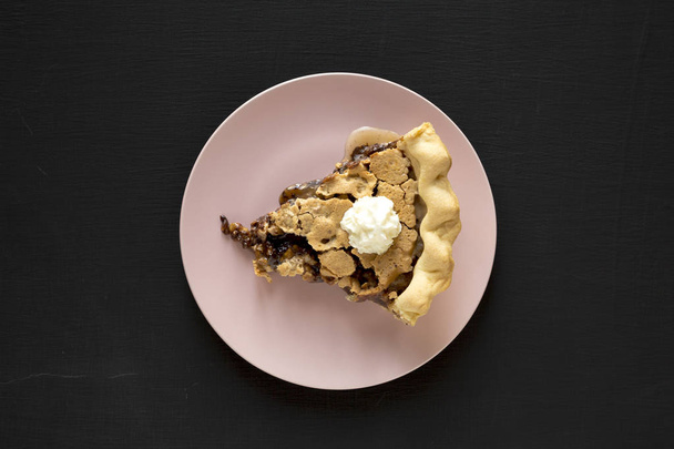 A piece of homemade Chocolate Walnut Derby Pie on a pink plate o - Foto, immagini
