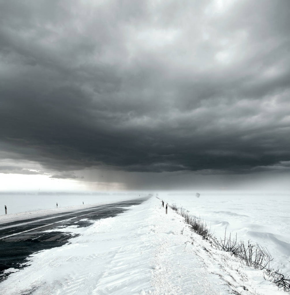 Stormy sky and snow road - Fotoğraf, Görsel