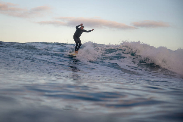 surfer riding waves on the island of fuerteventura - Fotografie, Obrázek