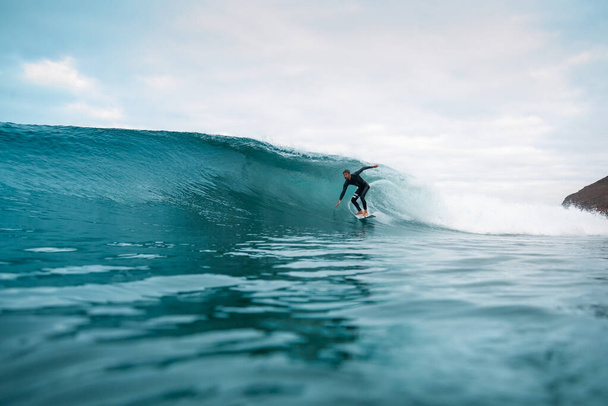 surfer riding waves on the island of fuerteventura - Photo, image