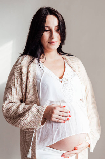Portrait of beautiful pregnant woman before childbirth family - Фото, изображение