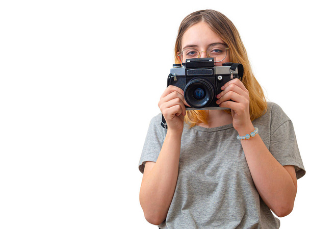 young girl takes pictures with a rare camera - Foto, imagen