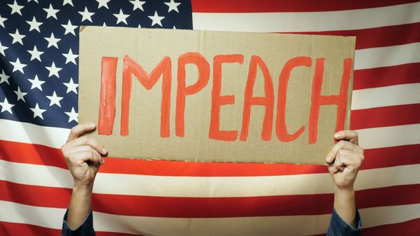 US President Impeachment sign in hands - Fotó, kép