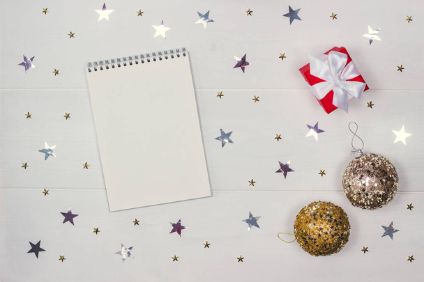 A notebook, ornaments and a gift box. - Фото, зображення