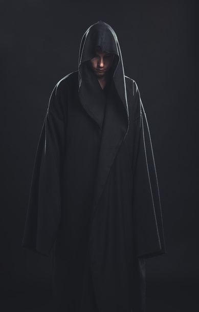 Portrait of man in a black robe - Foto, immagini