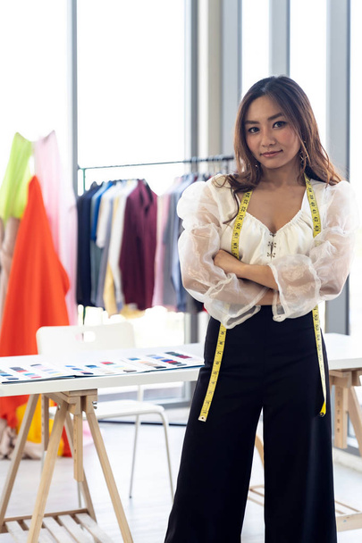 Portrait of young adult fashion designer as owner entrepreneur at her atelier studio. Using for entrepreneur startup concept. - Fotoğraf, Görsel