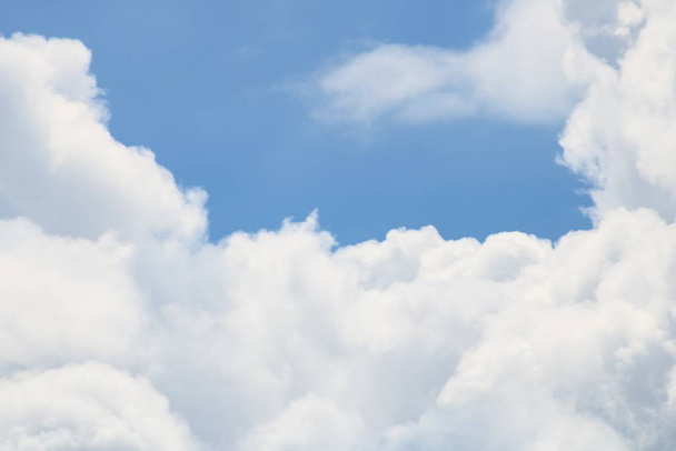 Closeup shot of fluffy white clouds in the beautiful blue sky - Valokuva, kuva