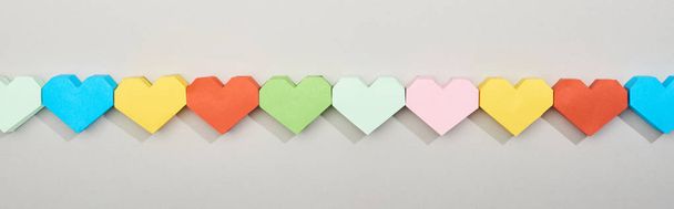 Top view of colorful heart shaped papers in line, panoramic shot - Фото, изображение