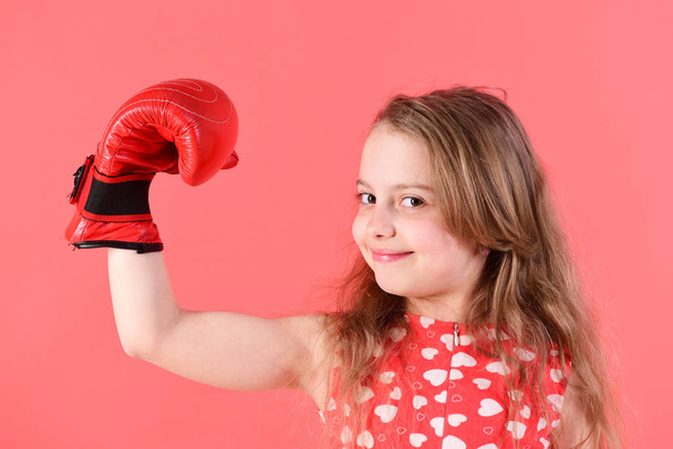Kid flex arm with muscle, biceps, triceps in boxing gloves - Photo, image