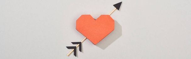 Top view of paper heart with arrow on grey background, panoramic shot - Fotó, kép