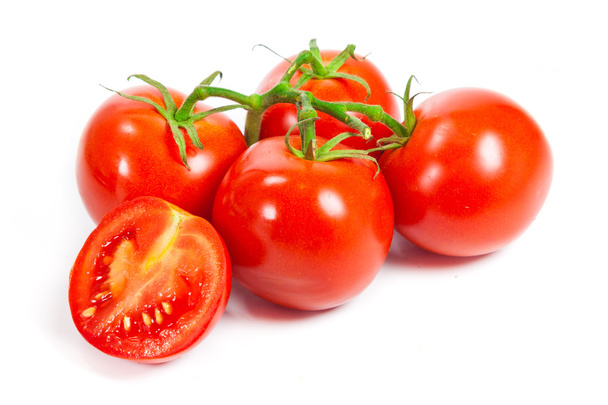 Closeup of tomatoes on the vine isolated on white. - Фото, зображення