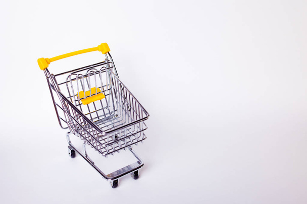 Shopping cart concept of shopping and sales, retail and shops. - Foto, Bild