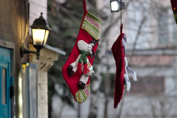 Socks hanging on the porch waiting for a gift from Santa - Foto, afbeelding