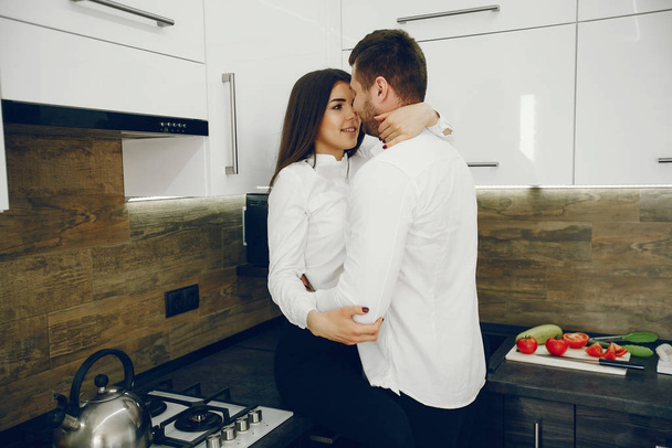 Couple in a kitchen - Fotó, kép