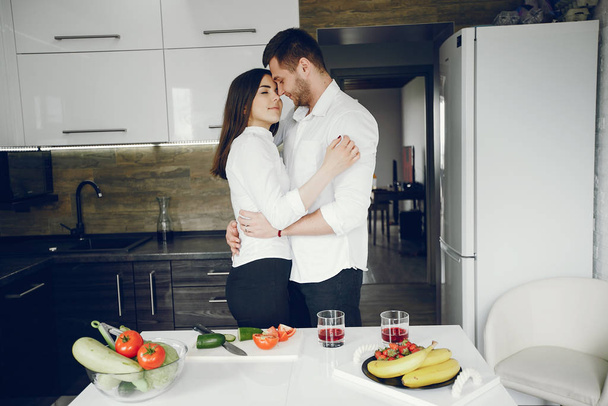 Couple in a kitchen - Photo, image